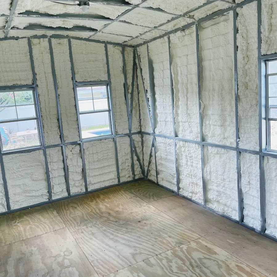 Closed-cell spray foam insulation applied to wall cavities in a residential project in McNair